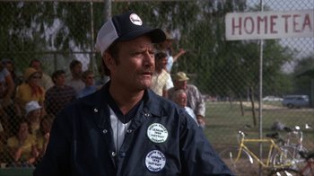 Movie still from “The Bad News Bears” (1976), directed by Michael Ritchie – A man wearing a baseball cap and a jacket; Close Up shot, Low angle