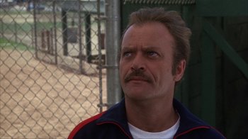 Movie still from “The Bad News Bears” (1976), directed by Michael Ritchie – A person with a mustache looking up; Close Up shot, Low angle