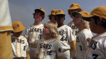 Movie still from “The Bad News Bears” (1976), directed by Michael Ritchie – A group of young baseball players standing next to each other; Medium shot, Low angle