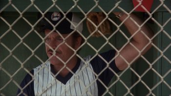 Movie still from “The Bad News Bears” (1976), directed by Michael Ritchie – A man in a baseball uniform holding a baseball bat; Medium shot, Low angle