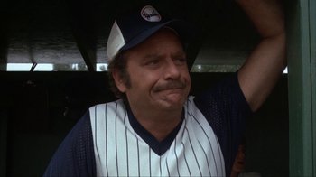 Movie still from “The Bad News Bears” (1976), directed by Michael Ritchie – A man in a baseball uniform with his mouth open; Close Up shot, Low angle