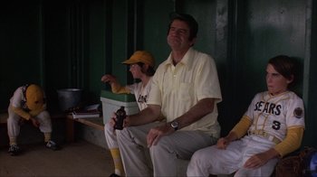 Movie still from “The Bad News Bears” (1976), directed by Michael Ritchie – A man and a boy sitting on a bench; Medium shot, Low angle
