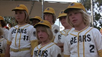 Movie still from “The Bad News Bears” (1976), directed by Michael Ritchie – A group of young baseball players in the stands; Medium shot, Low angle