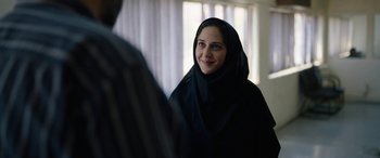 Movie still from “Holy Spider” (2022), directed by Ali Abbasi – A woman wearing a black veil looking into a mirror; Close Up shot, Over the shoulder angle