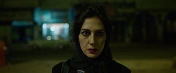 Movie still from “Holy Spider” (2022), directed by Ali Abbasi – A person wearing a scarf; Close Up shot, Low angle