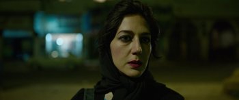 Movie still from “Holy Spider” (2022), directed by Ali Abbasi – A person wearing a scarf; Close Up shot, Low angle