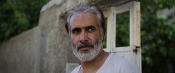 Movie still from “Holy Spider” (2022), directed by Ali Abbasi – A person with a beard; Close Up shot, Low angle