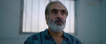 Movie still from “Holy Spider” (2022), directed by Ali Abbasi – A person with a beard; Close Up shot, Low angle