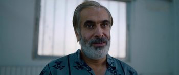 Movie still from “Holy Spider” (2022), directed by Ali Abbasi – A person with a beard; Close Up shot, Low angle