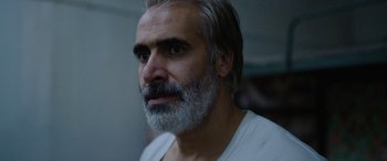 Movie still from “Holy Spider” (2022), directed by Ali Abbasi – A person with a beard; Close Up shot, Low angle