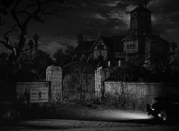 Movie still from “The Bad and the Beautiful” (1952), directed by Vincente Minnelli – An old house in the middle of the night; Extreme Wide shot, Low angle
