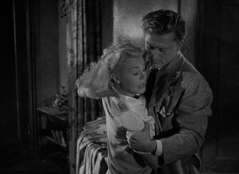 Movie still from “The Bad and the Beautiful” (1952), directed by Vincente Minnelli – A man and a woman are dancing in a room; Medium shot, Low angle