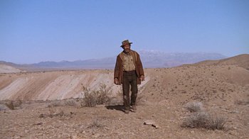 Movie still from “The Ballad of Cable Hogue” (1970), directed by Sam Peckinpah – A man standing in the middle of the desert; Wide shot, Low angle