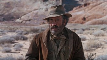 Movie still from “The Ballad of Cable Hogue” (1970), directed by Sam Peckinpah – An older man with a hat and a beard; Medium shot, Over the shoulder angle