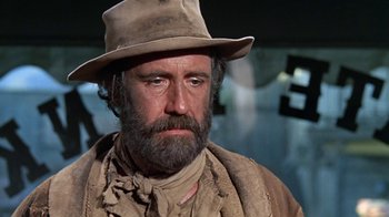Movie still from “The Ballad of Cable Hogue” (1970), directed by Sam Peckinpah – A man with a beard wearing a hat; Close Up shot, Low angle