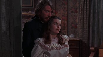 Movie still from “The Ballad of Cable Hogue” (1970), directed by Sam Peckinpah – A man and a woman standing next to each other in a room; Medium shot, Over the shoulder angle