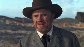 Movie still from “The Ballad of Cable Hogue” (1970), directed by Sam Peckinpah – A man in a suit and a brown hat; Close Up shot, Low angle