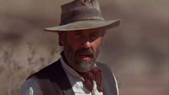 Movie still from “The Ballad of Cable Hogue” (1970), directed by Sam Peckinpah – An older man wearing a cowboy hat and a vest; Close Up shot, Low angle