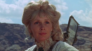 Movie still from “The Ballad of Cable Hogue” (1970), directed by Sam Peckinpah – A person wearing a dress; Close Up shot, Low angle