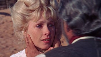 Movie still from “The Ballad of Cable Hogue” (1970), directed by Sam Peckinpah – A woman with her hands on her neck; Close Up shot, Over the shoulder angle