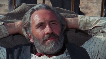 Movie still from “The Ballad of Cable Hogue” (1970), directed by Sam Peckinpah – An older man with a beard and a mustache; Close Up shot, Low angle