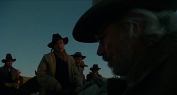 Movie still from “The Ballad of Gregorio Cortez” (1982), directed by Robert M. Young – A group of men wearing hats and jackets; Medium shot, Low angle