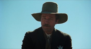 Movie still from “The Ballad of Gregorio Cortez” (1982), directed by Robert M. Young – A man with a mustache wearing a cowboy hat; Close Up shot, Low angle