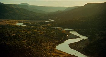 Movie still from “The Ballad of Gregorio Cortez” (1982), directed by Robert M. Young – A view of a river and a mountain range from above; Extreme Wide shot, High angle