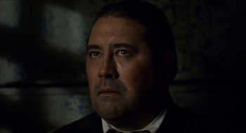 Movie still from “The Ballad of Gregorio Cortez” (1982), directed by Robert M. Young – A person wearing a suit and tie; Close Up shot, Low angle