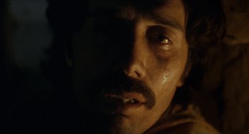 Movie still from “The Ballad of Gregorio Cortez” (1982), directed by Robert M. Young – A person with a beard and mustache; Extreme Close Up shot, Low angle