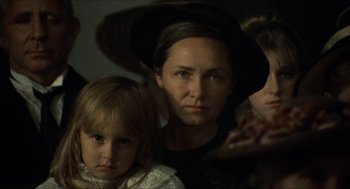 Movie still from “The Ballad of Gregorio Cortez” (1982), directed by Robert M. Young – A woman and two children are looking at the camera; Close Up shot, Over the shoulder angle
