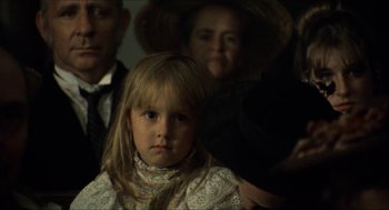 Movie still from “The Ballad of Gregorio Cortez” (1982), directed by Robert M. Young – A little girl sitting in front of an older woman; Close Up shot, Over the shoulder angle