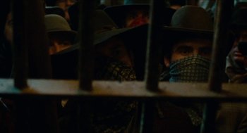 Movie still from “The Ballad of Gregorio Cortez” (1982), directed by Robert M. Young – A group of people wearing hats and bandannas; Close Up shot, Low angle