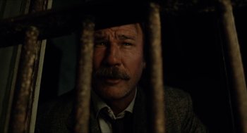 Movie still from “The Ballad of Gregorio Cortez” (1982), directed by Robert M. Young – A person behind a fence; Close Up shot, Low angle