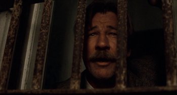 Movie still from “The Ballad of Gregorio Cortez” (1982), directed by Robert M. Young – A person behind a fence; Close Up shot, Low angle