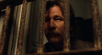 Movie still from “The Ballad of Gregorio Cortez” (1982), directed by Robert M. Young – A person behind a fence; Close Up shot, Low angle