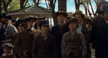 Movie still from “The Ballad of Gregorio Cortez” (1982), directed by Robert M. Young – A group of young men standing next to each other; Medium shot, Low angle