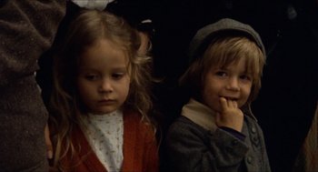 Movie still from “The Ballad of Gregorio Cortez” (1982), directed by Robert M. Young – Two young children sitting next to each other; Close Up shot, High angle