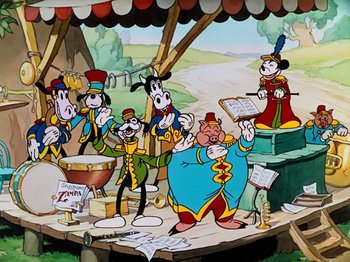 A group of cartoon characters are gathered around a stage