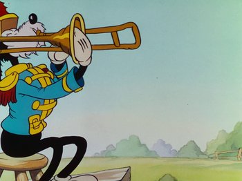 Movie still from “The Band Concert” (1935), directed by Wilfred Jackson – A cartoon of a dog playing a trombone; Medium shot, Low angle
