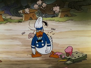 Movie still from “The Band Concert” (1935), directed by Wilfred Jackson – A cartoon of donald duck kneeling down in front of a tank; Medium shot, High angle