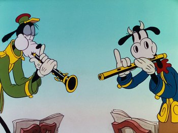Movie still from “The Band Concert” (1935), directed by Wilfred Jackson – Two cartoon characters are playing musical instruments; Medium shot, Low angle