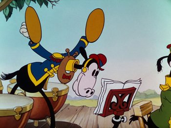 Movie still from “The Band Concert” (1935), directed by Wilfred Jackson – A goofy cartoon character is flying through the air while another cartoon character looks on; Medium shot, Low angle