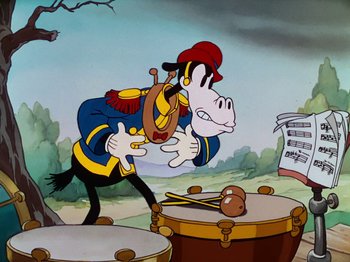 Movie still from “The Band Concert” (1935), directed by Wilfred Jackson – A cartoon of a goofy character playing a musical instrument; Medium shot, Low angle