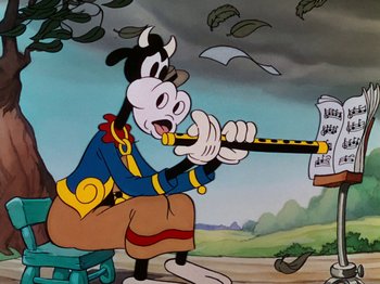 Movie still from “The Band Concert” (1935), directed by Wilfred Jackson – A cartoon of a goofy dog holding a pencil; Medium shot, Low angle