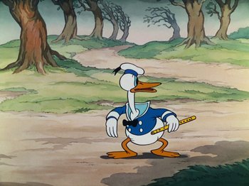 Movie still from “The Band Concert” (1935), directed by Wilfred Jackson – A painting of a duck holding a stick in its mouth; Medium shot, High angle