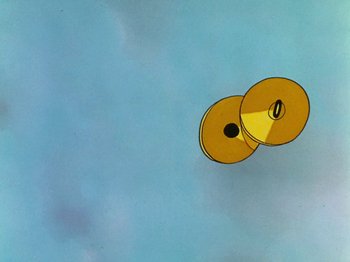 Movie still from “The Band Concert” (1935), directed by Wilfred Jackson – A pair of yellow discs floating in the sky; Extreme Wide shot, Overhead angle