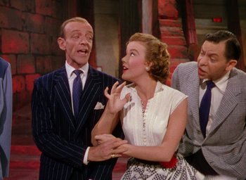Movie still from “The Band Wagon” (1953), directed by Vincente Minnelli – A man and a woman and a man and a woman; Medium shot, High angle
