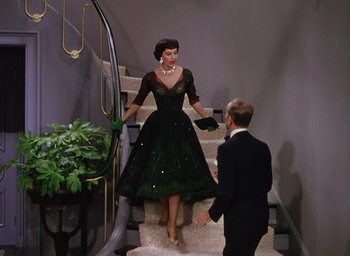Movie still from “The Band Wagon” (1953), directed by Vincente Minnelli – A man and a woman walking down the stairs; Wide shot, High angle