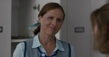 Movie still from “Horse Girl” (2020), directed by Jeff Baena – A person wearing a shirt and tie; Close Up shot, Over the shoulder angle